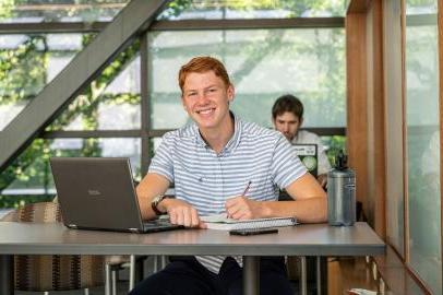 Male business student posing indoors.